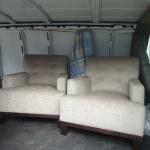 Custom built thigh seat and back chairs with button tufting and walnut base.