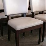 Custom built dining chair with walnut base, legs, and keyhole trim.  Baseball stitched detail, upholsterd in leather.