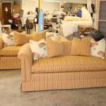 Two mathching skirted sofas with custom pillows.
